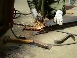 HD:Worker grinding on steel Stock Footage