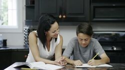 Mother Helping Son with Homework Stock Footage