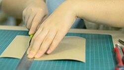 close up: cut paper with cutter and stainless ruler Stock Footage