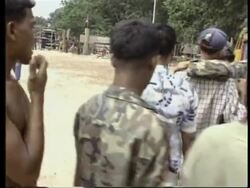 Cambodia - Casualties arrive at medical base News Clip