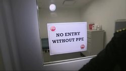 Demonstration of Ebola screening at Dulles Airport; personal protective equipment News Clip