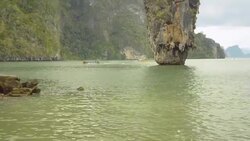 traveling boating float pass though Ko Tapu island Stock Footage