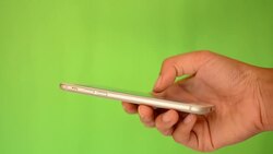 Smartphone touchscreen on green screen Stock Footage