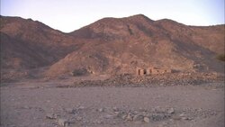 Mountains border the ruins of the ancient settlement of Shenshef, Egypt. Stock Footage