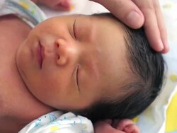 Mother touch baby hair with love Stock Footage