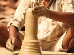 Man making a earthen pot on a pottery wheel, Faridabad, Haryana, India Stock Footage