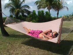Blond girl sleeping on an hammock Stock Footage