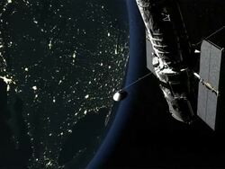 WS PAN Shot of Hubble Space Telescope set against the Earth's night side, lights of cities lit up against dark, Post 2002 version of Telescope Stock Footage
