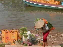 MS PAN Shot of HA girl climbing stairs with heavy bag on her back / Mountain village near Muang Ngoi, Luang Prabang, Laos Stock Footage
