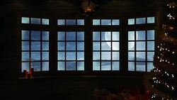 Christmas Scene Through Window With Snow Falling 4K - Loopable Stock Footage