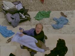 MS, HA, Man standing on steps and catching falling clothes, Saint Ferme, Gironde, France Stock Footage
