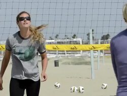 CU of female beach volleyball players team warming up, peppering and rallying with the ball. Stock Footage