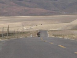 Pull back shot Highway with mountains Taklakot Tibet China Stock Footage