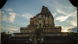 Chedi Luang Pagoda, Sunrise at Wat Chedi Luang Temple with cloudy sky and lens flare - Chiang mai, Thailand Stock Footage