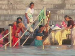 WS Women washing and bathing in the Ganges River / Kashi, Uttar Pradesh, India Stock Footage