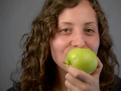 Young woman eat green apple Stock Footage
