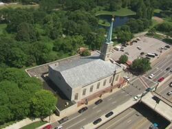 MS Traffic moving on road infront of church / St Louis, Missouri, United States Stock Footage