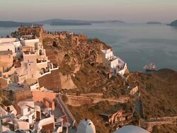 WS View of tourists on hill at Sun settin in village Oia / Santorini, Cyclades, Greece Stock Footage