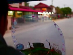 MS POV SLO MO Shot of road seen from moving tuk tuk / Luang Prabang, Laos Stock Footage