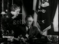 1937: FDR SIGNING PAPER: President Franklin Delano Roosevelt FDR sitting at desk signing paper for unidentified woman (believed to be secretary Marguerite 'Missy' LeHand), blotting his signature on paper. Instructional Video