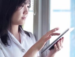 Collegian typing on digtal table Stock Footage