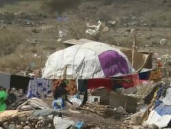 MS Shot of woman fixing laundry / Djibouti Stock Footage