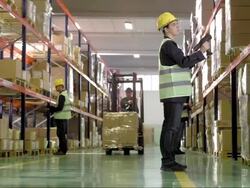 Female Employee Scanning Boxes In Warehouse Stock Footage