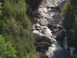 WS ARIEAL ZI ZO View of Stream of lake water in forest /Maine, United States Stock Footage
