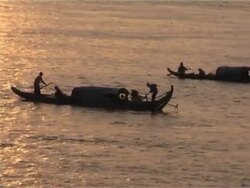 Tonle Sap River, Phnom Penh, Cambodia with Traditional Boats Stock Footage