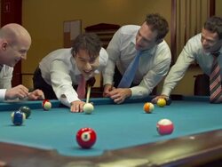 HD DOLLY: Businessmen Playing Eight-Ball Pool Game Stock Footage