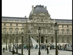 WA of Louvre entrance with glass pyramid in foreground, Paris Stock Footage