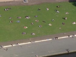  AERIAL WS POV People relaxing in lawn  / Hamburg, Hamburg, Germany Stock Footage