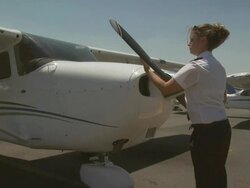 Pilot checking aircraft propellor, Australia Stock Footage