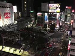 WS T/L View of Crowds and traffic on Hachiko Crossing at night / Shibuya, Tokyo, Japan  Stock Footage