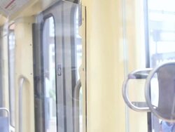 MS Well dressed young businessman riding on commuter train in urban area / Minneapolis, Minnesota, United States Stock Footage