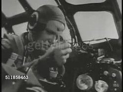 1944: NEW BOMBERS: AERIAL: B-29S in flight. MS US Bomber pilot. MS Navigator. MS Radar operator. CU Radar screen. WS B-29 'Superfortress' heavy bombers in flight.   Pacific Campaign, Pacific Front, WWII, World War II. Instructional Video