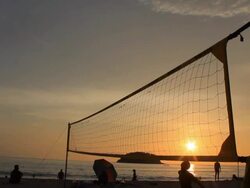 silhouette of volleyball players on the beach at sunset Stock Footage