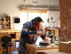 Native American artist using digital tablet in his art studio Stock Footage