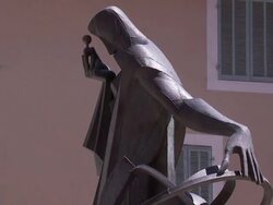 A statue depicts Nostradamus with an armillary sphere. Stock Footage