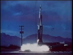1960s wide shot missile blasting off from launch structure (night?) / Cold War / documentary Stock Footage