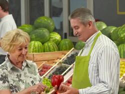 HD: Worker Helping To Choose The Right Produce Stock Footage