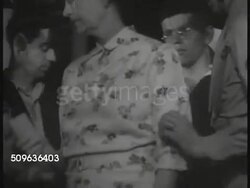 1937: CHINA EVACUATION: US soldiers supervising, assisting evacuation of American citizens in China, people at dock area, people onto boats,  CU Life preserver of USS Panay. XWS USS Panay (patrol boat, Yangtze River, Asiatic fleet) on river. Instructional Video