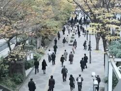 People going to work early morning in Shinjuku, Tokyo, Japan Stock Footage