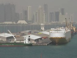 WS ZO ZI  Ship on large dock seemingly floating in harbor of city with skyline of city / Doha, Qatar   Stock Footage