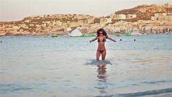 Hot girl enjoying the beautiful clear water on Malta coast Stock Footage