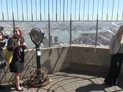 Abigail Breslin poses for photographers on the 86th floor observatory of the Empire State Building for Project Sunshine Stock Footage