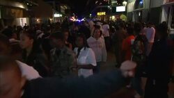 Crowds fill Bourbon Street at night. Stock Footage