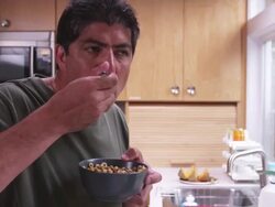 MS Man in kitchen, standing, eating cereal / Portland, Oregon, United States Stock Footage