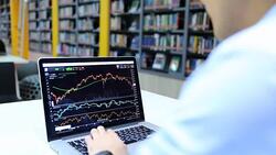Businessman looking at graph stock Data on Laptop Stock Footage