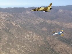 AIR TO AIR, MS, Two Aero L-39 Albatroses flying over Mojave Desert mountains, California, USA Stock Footage